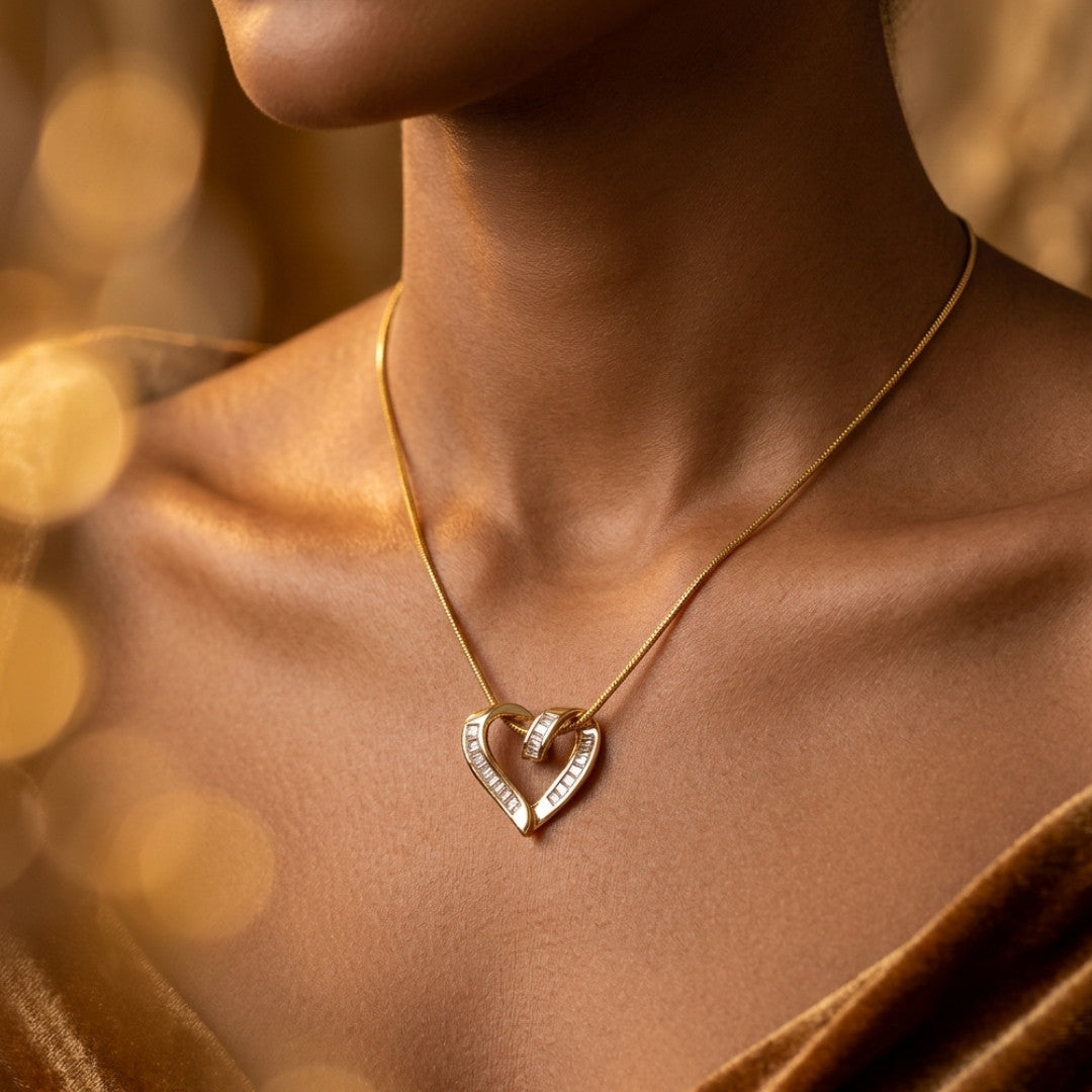 Interlocking Crystal Baguette Heart Pendant Necklace – Elegant Gold-Tone Rope Chain