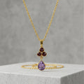 Gold-Tone Delicate Pendant Necklace with Deep Red Crystal Cluster and Amethyst-Hued Teardrop Stone
