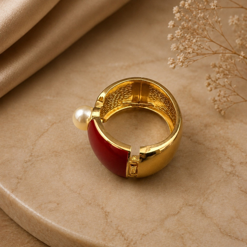 Gold-Tone Statement Cuff Bracelet with Deep Red Accents and Central Pearl
