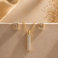 Golden Cylinder Pavé Crystal Jewelry Set – Luxe Pendant Necklace & Matching Hoop Earrings
