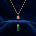 Emerald Teardrop Pendant Necklace with Delicate Floral Accent