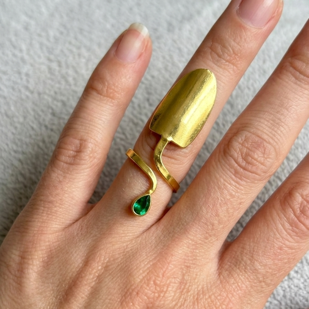Artisan Gold-Tone Statement Ring – Sculptural Nail-Inspired Design with Green Accents